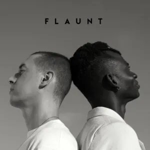 A black-and-white image of two artists leaning back-to-back, symbolizing balance, collaboration, and individuality in the music industry—core values that TMMA nurtures through expert music marketing and promotion.